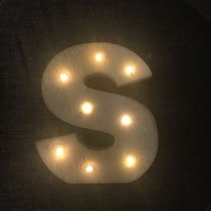 Decorative “S” marquis sign